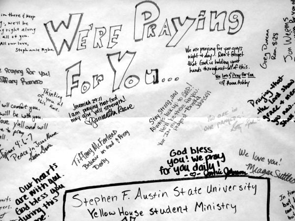 After the massacre, a banner from students involved in the campus ministry at Stephen F. Austin University in Nacogdoches, Texas, hangs in the foyer of the Blacksburg Church of Christ in Virginia.