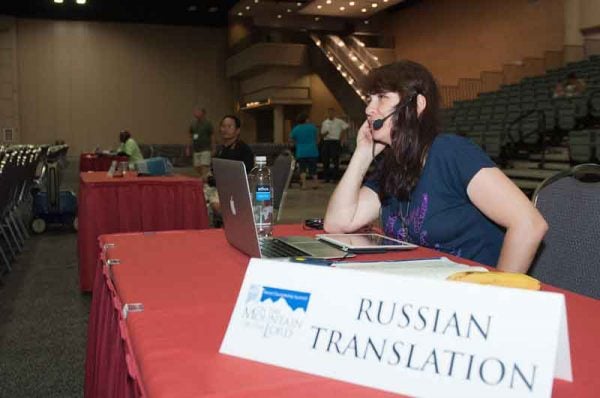 A volunteer provides a Russian translation.Messages were translated into six languages.