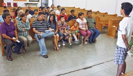 Christians from Mexico sing during a midday devotional at the Faith Village Church of Christ. – PHOTO BY ERIK TRYGGESTAD