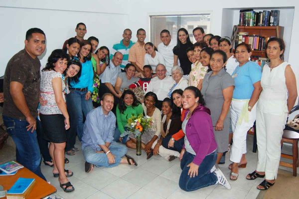 Clyde and Gwen Antwine, center, share smiles with church members in Venezuela.