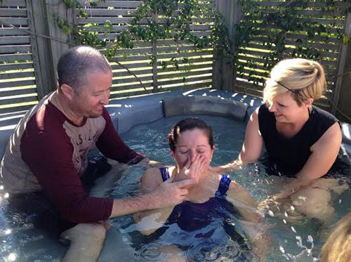Justin and Jennifer Cherry celebrate a baptism in Auckland