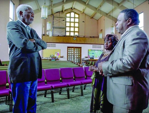 Morgan Freeman interviews hurricane survivors Charles and Angela Marsalis at the Carrollton Avenue Church of Christ in New Orleans.