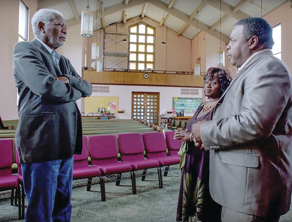 Morgan Freeman interviews hurricane survivors Charles and Angela Marsalis at the Carrollton Avenue Church of Christ in New Orleans.