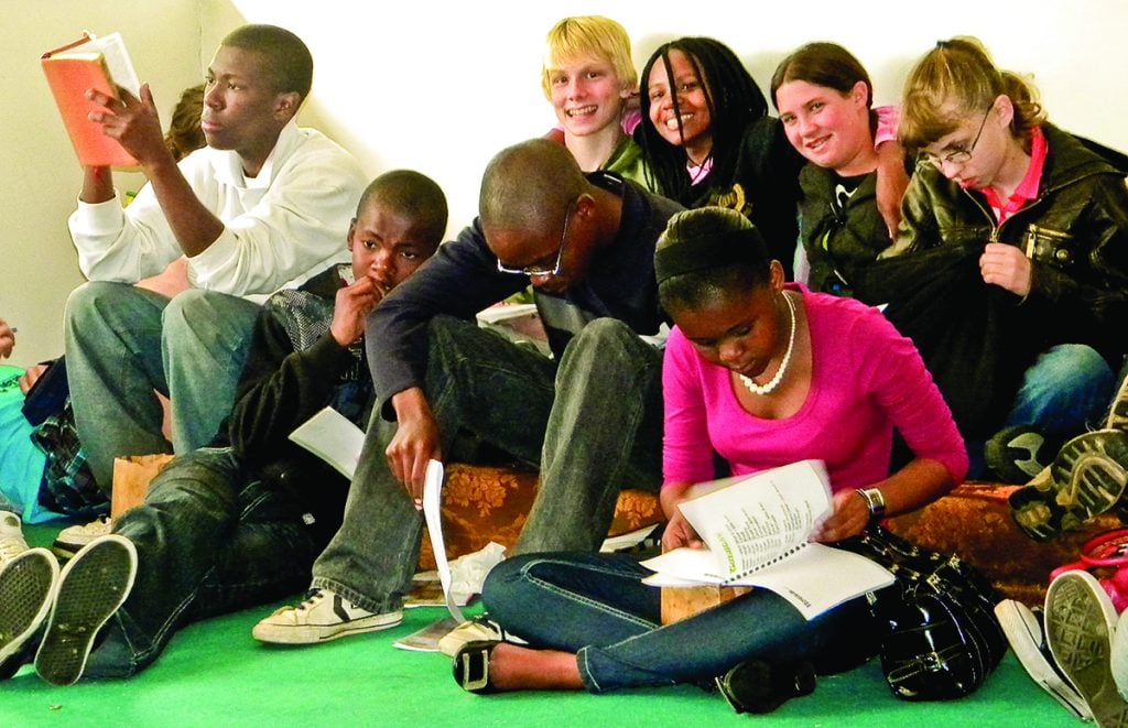 Young people of all races study the Bible together during the Southern Africa Bible College lectureship in 2009.