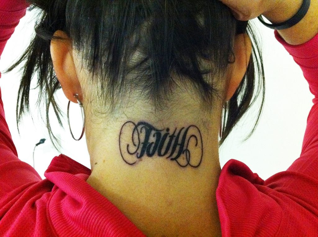 Church member Holly Holladay displays the “Faith” and “Hope” tattoo on the back of her neck.