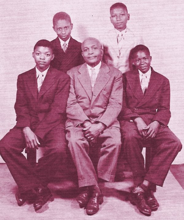 Marshall Keeble sits with a few of his “boy preachers,” including Hassen Reed and Robert McBride, both standing, and Robert Wood and Fred Gray.