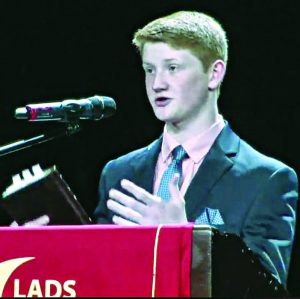 Logan Richardson shares a message before the Lord's Supper as the Nashville Lads to Leaders convention closes. 
