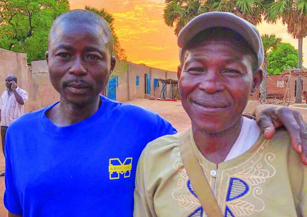 When Pascal Ngarndei, right, was baptized, his brother, François March, objected. In January March and his daughter were baptized.