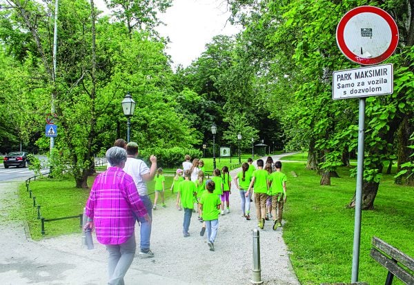 Children and volunteers visit a park during Champs Camp in Zagreb. The weeklong camp has expanded to two locations since its launch nearly a decade ago.