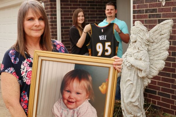 Deniece Bell-Pitner holds a portrait of her daughter Danielle, who was killed in the 1995 bombing. In the background are Bell-Pitner’s son Brayden, 19, and daughter Dylann, 16, holding an Oklahoma City Thunder jersey created by the team to honor Danielle.