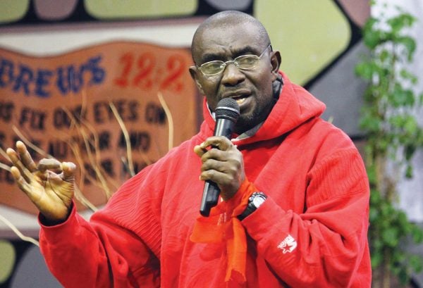 Isaac Adotey speaks at the 2012 Africans Claiming Africa for Christ conference in Lusaka, Zambia. His baggage was delayed, so he addressed the conference in a hoodie and jeans.