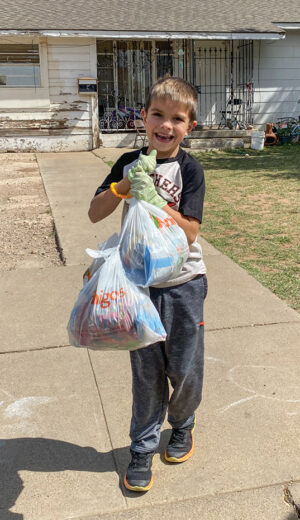 Young volunteers help deliver food as part of the program.