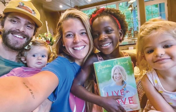 Lauren Akins, with husband Thomas Rhett and their three daughters, celebrates the release of her book “Live in Love.”