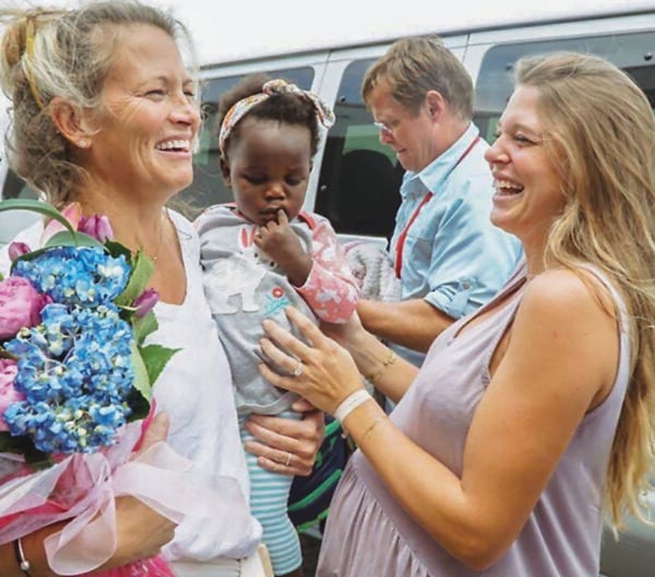 Lauren’s parents, Steve and Lisa Gregory, bring Willa Gray home from Uganda after her adoption by Thomas Rhett and Lauren was finalized in May 2017. 
