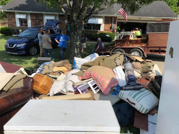 The elders at Rolling Hills Church of Christ assist with flood cleanup. 