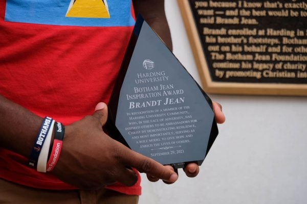 Brandt Jean holds the Botham Jean Inspiration Award.