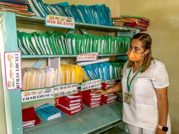 Color-coded folders, divided by communities, hold the medical records of families served by the El Cerro clinic in the Culmí municipality.
