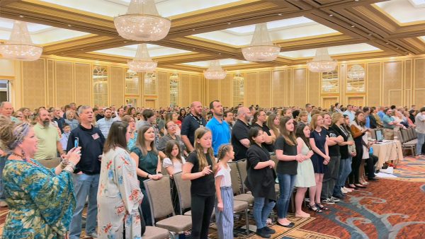 Church members sing during an Easter morning worship service at the North Texas Leadership Training for Christ convention in Dallas.