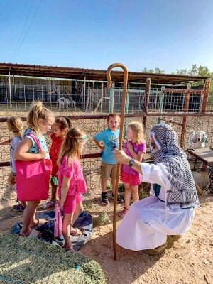 Kids at the encampment learn about sheep and goats from the Good Shepherd, portrayed by James Willeford, director of church relations for Herald of Truth.