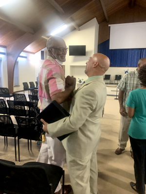 Greg Jasper fellowships with a member of the recently merged Church of Christ at Kennedy Heights.