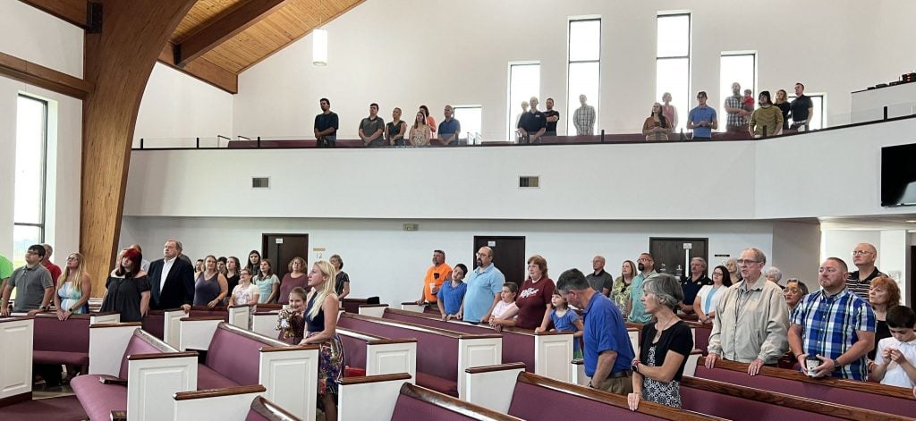 The Marysville Church of Christ stands to sing during a Sunday morning assembly of the central Ohio congregation.