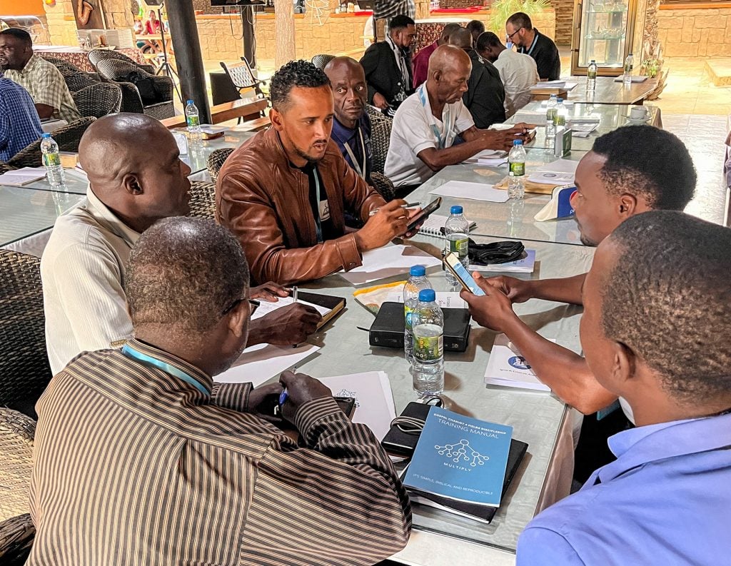 Adriano Lopes, a minister in the island nation of Cape Verde, discusses evangelism with fellow Portuguese-speaking preachers during a breakout session at the the Luso-Africa Global Mission Gathering in Angola.