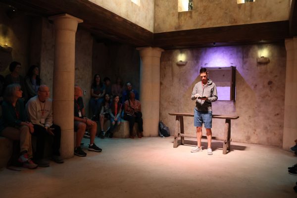 Memorial Road preacher Phil Brookman reads from Isaiah 61, as Jesus did in Luke 4, in the replica of the synagogue at the Museum of the Bible.