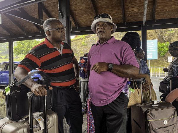 Richard Le Blanc, right, greets Trinidad church elder Michael Harris at the Grenada airport.
