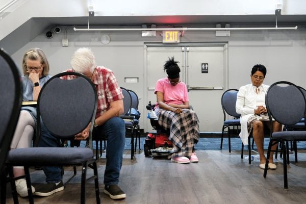 Christians only — or the only Christians? 2 MyCelestialApp Bill and Judy Robinson, at left, pray during a Tuesday night Bible study.