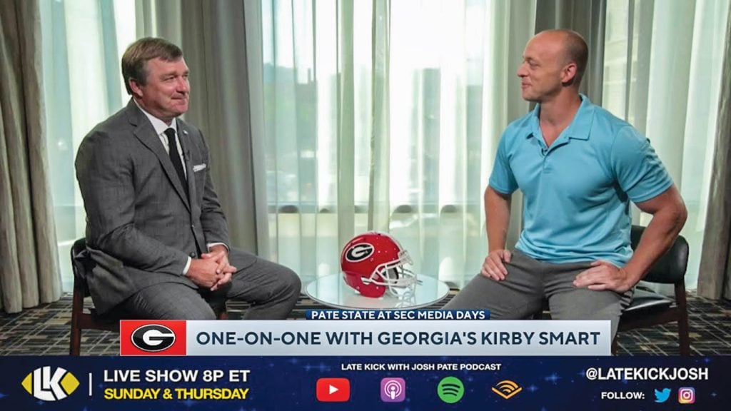 Josh Pate, right, talks with Kirby Smart, head coach of the back-to-back national champion Georgia Bulldogs, during SEC Football Media Days in Nashville, Tenn.