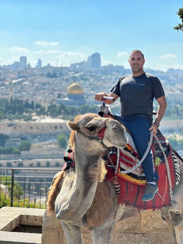 Arab Israeli Christian and Holy Land tour guide Sandro Jadon takes visitors to historic sites — and occasionally provides camel rides.