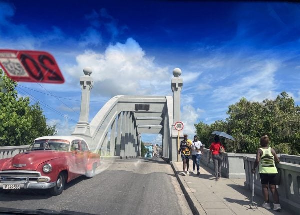 A classic car crosses a bridge in Matanzas. Decades-old vehicles are a common sight on Cuban roads because of a longstanding U.S. trade embargo.