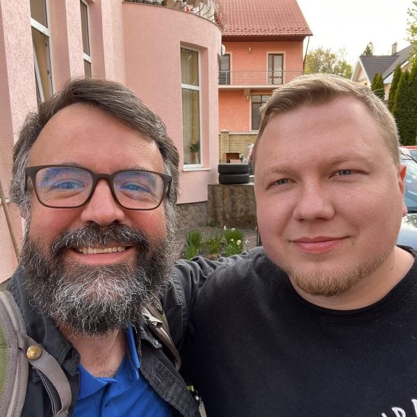 Erik Tryggestad, left, takes a selfie with Ukrainian preacher Alexander Rodichev outside the meeting place of the Church of Christ in Chernivtsi, Ukraine, in 2022.