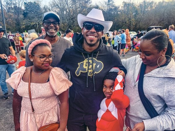 In his Deion Sanders gear, Hillsboro minister Darwin Mason Jr. Trunk or Treats with his dad, Darwin Sr., daughter Deryn, son Levi and wife Kayla. 