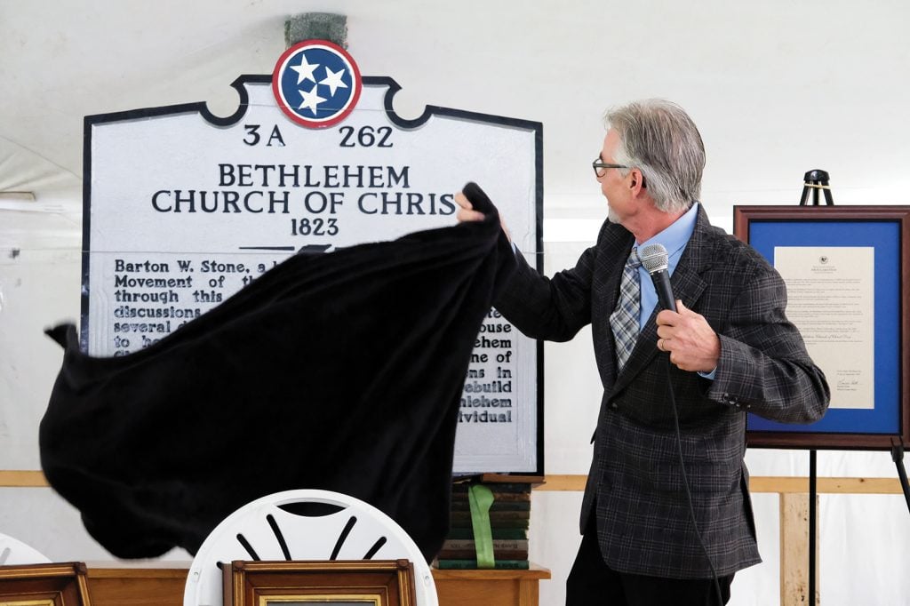 Pulpit minister Donnie Rhoten unveils a historical marker for the Bethlehem Church of Christ in Tuckers Crossroads, Tenn., about 35 miles east of Nashville. The rural congregation recently celebrated its 200th anniversary.