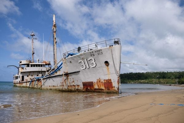 The MV Betsy Ross FS 313, a decommissioned World War II ship, rusts on the Teouma Bay beach in Port Vila, Vanuatu.