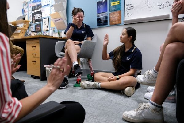 Jada Black, right, talks during a meeting for the Redlands College 2024 student mission trip to the U.S. Black was baptized at Lipscomb University during the mission trip in 2023.
