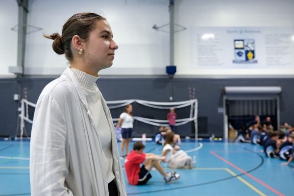 Braiden Jackson stands at the back of a Redlands School assembly in the sports centre.