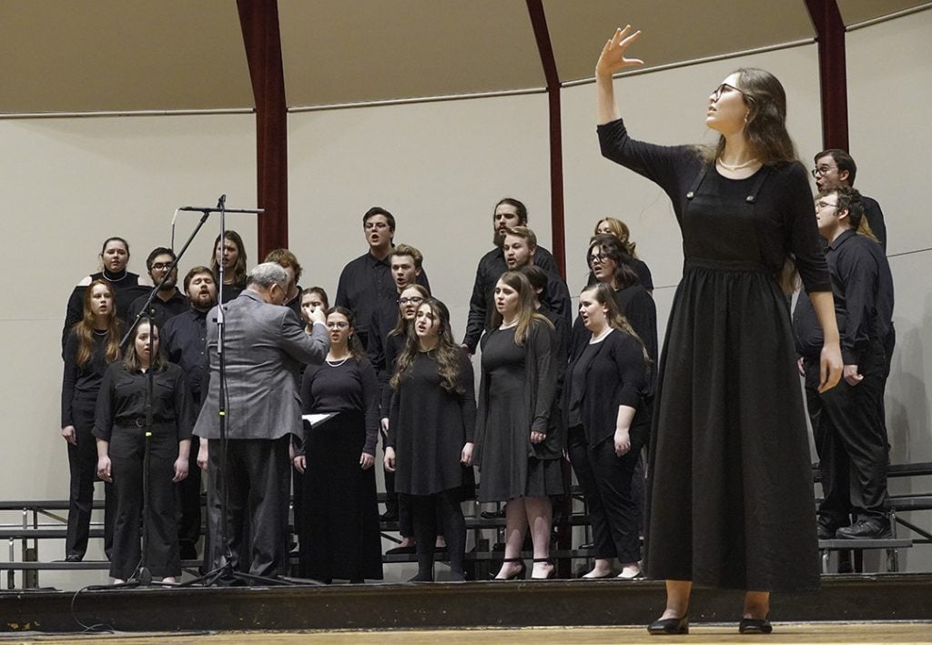The Freed-Hardeman University Chorale sings — and signs — at the conclusion of Tuesday night lectures.