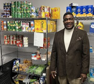 Brian Wroten in the food pantry of the Greater Metropolitan Church of Christ in Kansas City, Mo.