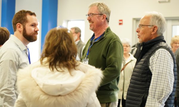 Ethan Bilbrey, left, from Richfield, Minn.; Scott Laird, center, from Great Falls, Mont.; and Randy Schow from Longmont, Colo., catch up during the Equip Conference.