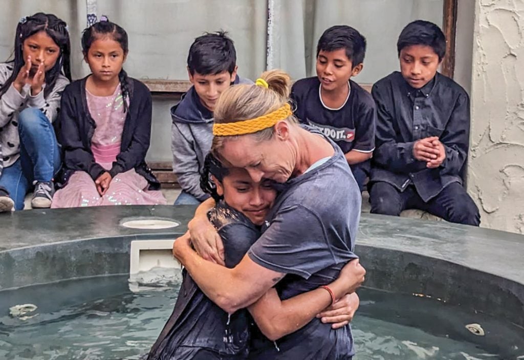 Jauna Reeger hugs a newly baptized sister in Christ at Hacienda of Hope in Tabacundo, Ecuador.