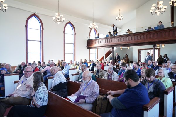 Equip Conference attendees listen to a panel discussion in the prayer chapel at York University.