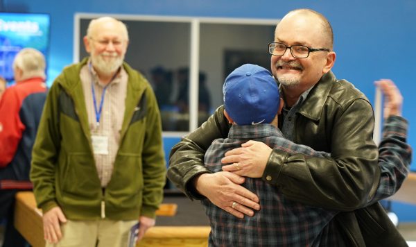 Walter Clark hugs a friend during the Equip Conference. Clark, minister for the Bismarck Church of Christ in North Carolina, traveled to Nebraska with his wife, Cindy.