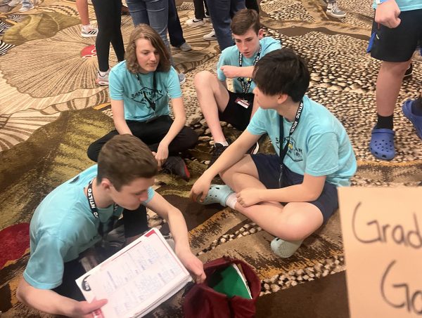 Students from the Memorial Road Church of Christ in Oklahoma City do some last-minute prep before Bible Bowl at the North Texas Leadership Training for Christ conference.