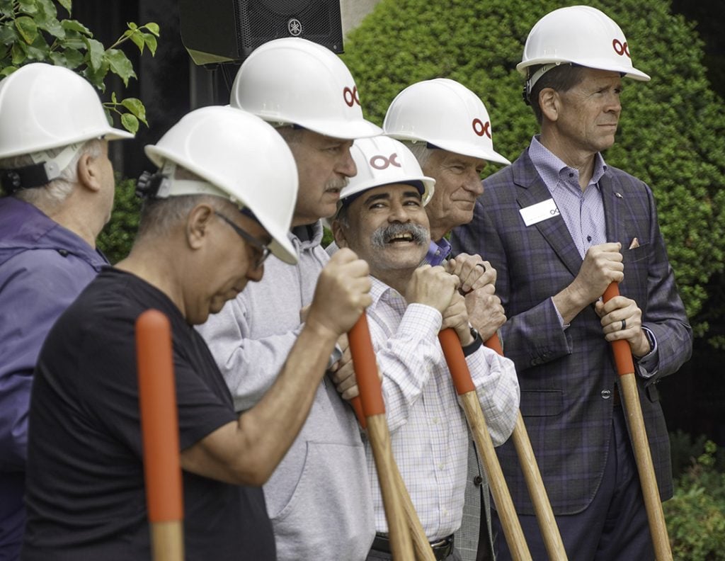 Ron Vega, center, shares a laugh with fellow groundbreakers at Oklahoma Christian University.