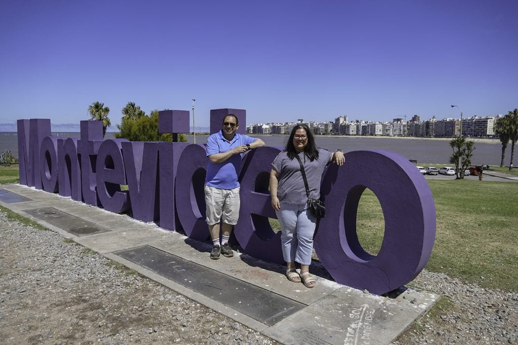 Eduardo and Odalis Vásquez stand by the first letters of their names on Montevideo’s Rambla, an avenue on the Río de la Plata.