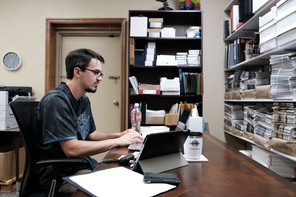 Nic Fraraccio works at his desk at The Christian Chronicle office in Oklahoma City.