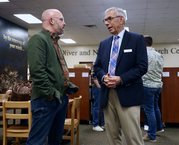 Jim Martin, right, vice president of Harding School of Theology in Memphis, Tenn., chats with Garrett Best, an alumnus who serves as chair of the Department of Bible and Ministry at York University in Nebraska.