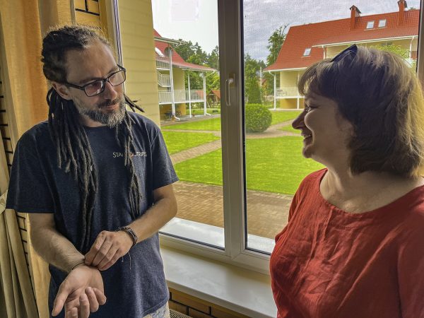 Olexiy Ladyka, left, speaks with Inna Kuzmenko, a Ukrainian Christian and translator, during the retreat in Irpin.